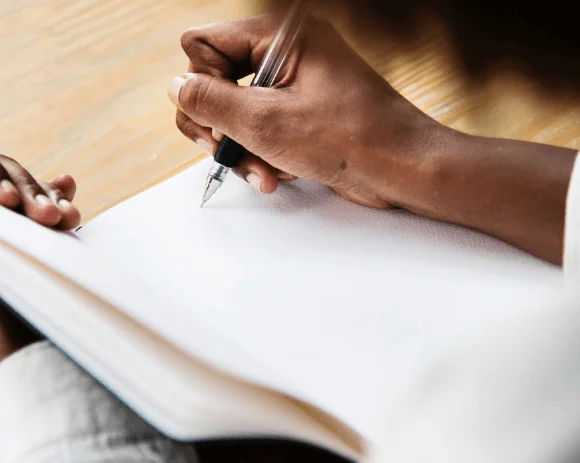 Men Writing in notebook