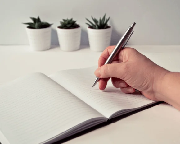 Men Writing in notebook